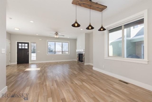 500 Westgate, Bozeman, MT 59718 - unfurnished living room featuring light wood-style floors, baseboards, a ceiling fan, a fireplace, and recessed lighting