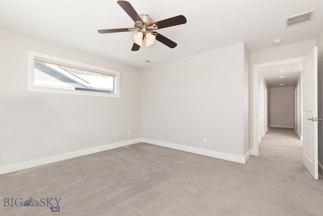 500 Westgate, Bozeman, MT 59718 - spare room featuring light colored carpet, baseboards, ceiling fan, and a smoke detector
