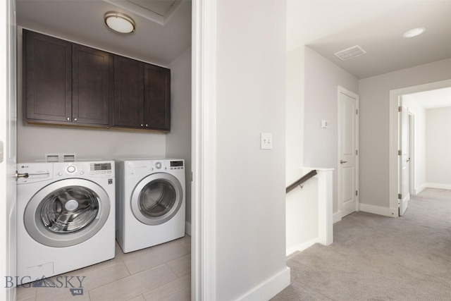 500 Westgate, Bozeman, MT 59718 - washroom featuring washing machine and dryer, cabinet space, baseboards, and light carpet