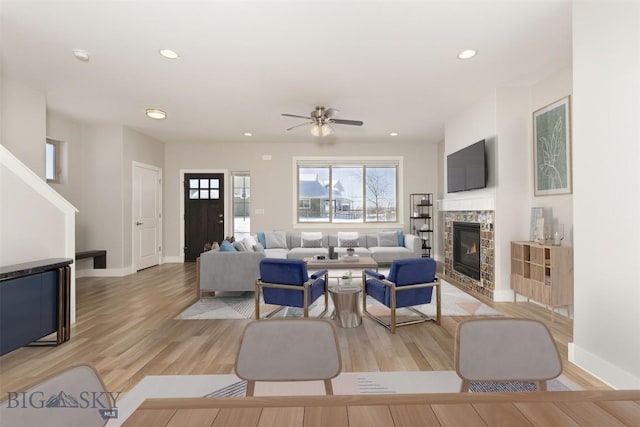 500 Westgate, Bozeman, MT 59718 - living room with recessed lighting, light wood-style flooring, a glass covered fireplace, ceiling fan, and baseboards