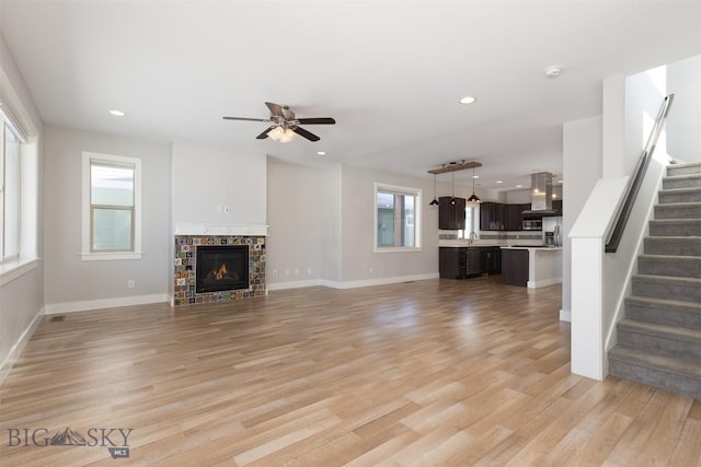 500 Westgate, Bozeman, MT 59718 - unfurnished living room with stairs, ceiling fan, light wood-style flooring, recessed lighting, and baseboards
