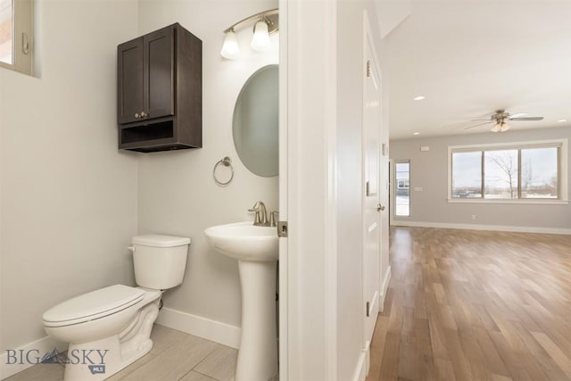 500 Westgate, Bozeman, MT 59718 - half bath with toilet, ceiling fan, wood finished floors, baseboards, and a sink