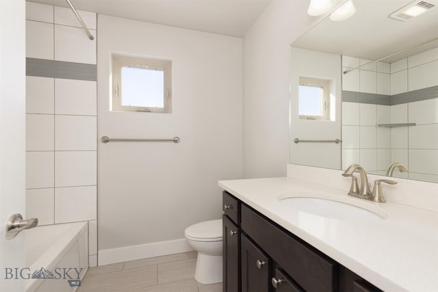 500 Westgate, Bozeman, MT 59718 - full bath featuring toilet, vanity, baseboards, bathtub / shower combination, and tile patterned floors