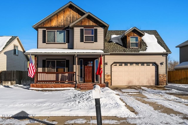 view of front of property featuring a porch, an attached garage, and fence