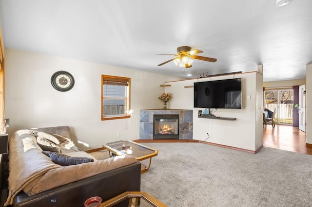 1014 Idaho St, Belgrade, MT 59714 - carpeted living room with ceiling fan and a tiled fireplace