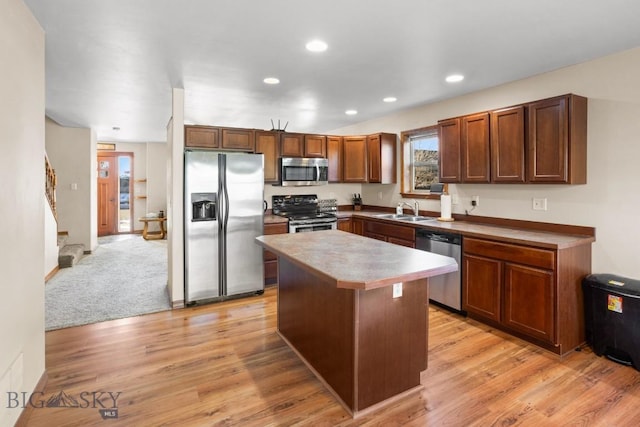 1014 Idaho St, Belgrade, MT 59714 - kitchen with stainless steel appliances, a kitchen island, light wood finished floors, recessed lighting, and light countertops