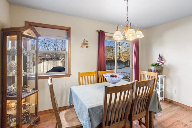 1014 Idaho St, Belgrade, MT 59714 - dining room with a chandelier and wood finished floors