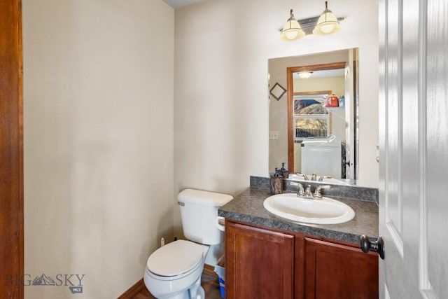 1014 Idaho St, Belgrade, MT 59714 - half bathroom featuring vanity and toilet