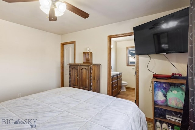 1014 Idaho St, Belgrade, MT 59714 - bedroom featuring ensuite bathroom, ceiling fan, and wood finished floors