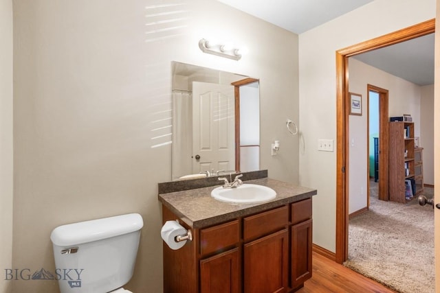 1014 Idaho St, Belgrade, MT 59714 - full bathroom featuring vanity and wood finished floors