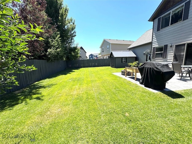 1014 Idaho St, Belgrade, MT 59714 - fenced backyard featuring a patio area and a shed
