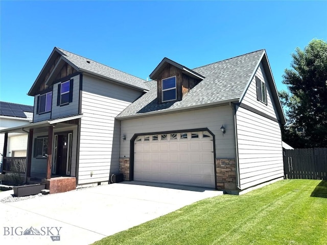 1014 Idaho St, Belgrade, MT 59714 - view of front of property with a garage, a shingled roof, concrete driveway, and stone siding