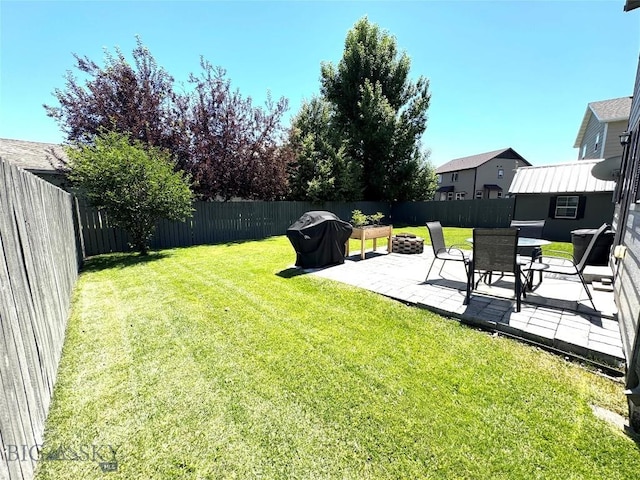 1014 Idaho St, Belgrade, MT 59714 - fenced backyard with a patio area and a fire pit