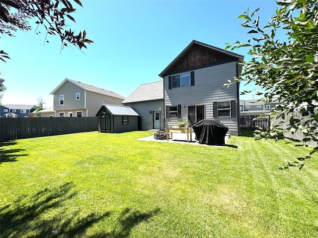 1014 Idaho St, Belgrade, MT 59714 - back of house featuring a shed, a fenced backyard, and a patio area