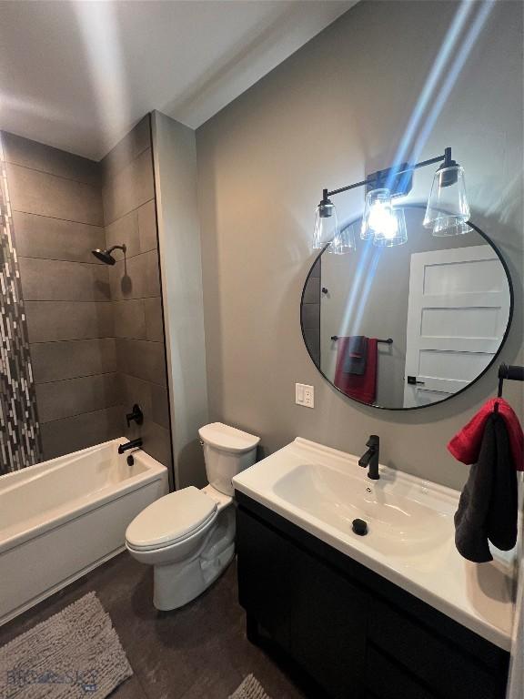 bathroom featuring  shower combination, toilet, and vanity