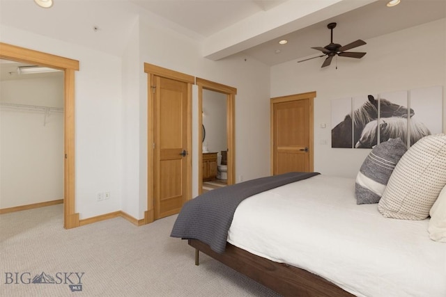 bedroom featuring light carpet, baseboards, a spacious closet, a closet, and recessed lighting