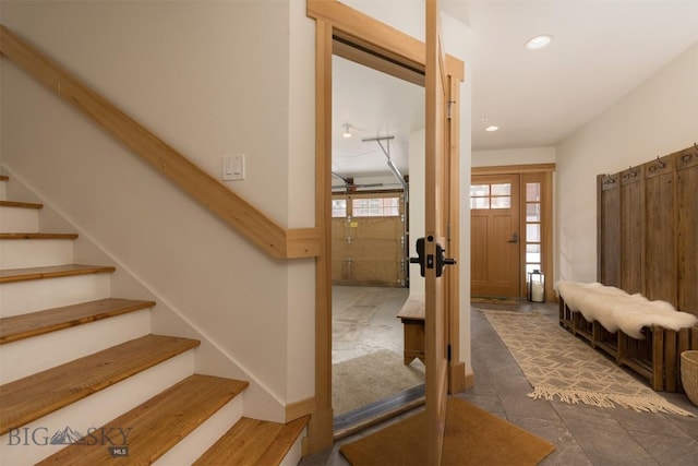 entryway with stairs and recessed lighting