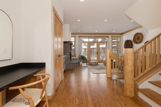 entryway featuring light wood-style floors, recessed lighting, french doors, and stairs