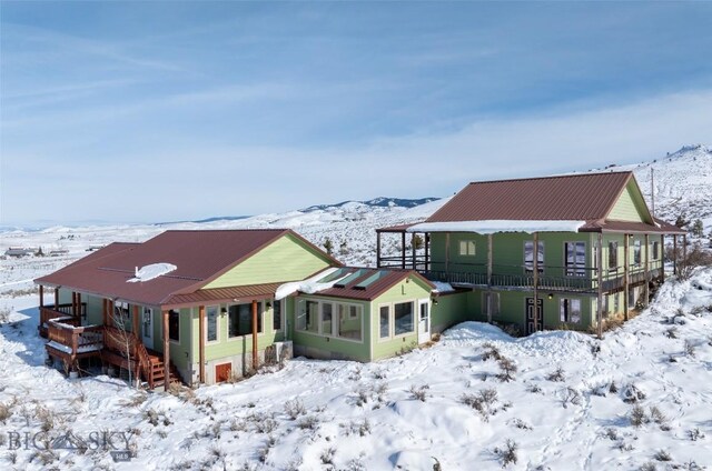 view of snow covered property