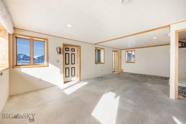 unfurnished room featuring unfinished concrete flooring and recessed lighting