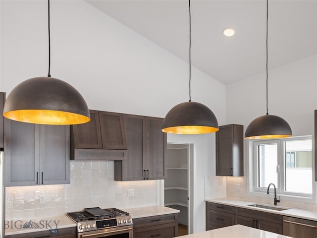 2820 S 30th Ave, Bozeman, MT 59718 - kitchen with a sink, stainless steel appliances, decorative backsplash, light countertops, and high vaulted ceiling
