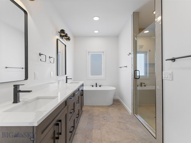 2820 S 30th Ave, Bozeman, MT 59718 - full bath featuring a stall shower, double vanity, a freestanding bath, recessed lighting, and baseboards