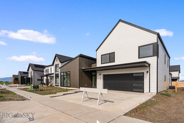 2820 S 30th Ave, Bozeman, MT 59718 - modern home with an attached garage and driveway