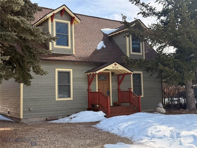 view of front of house with roof with shingles