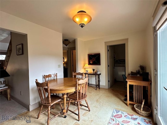 dining area featuring baseboards