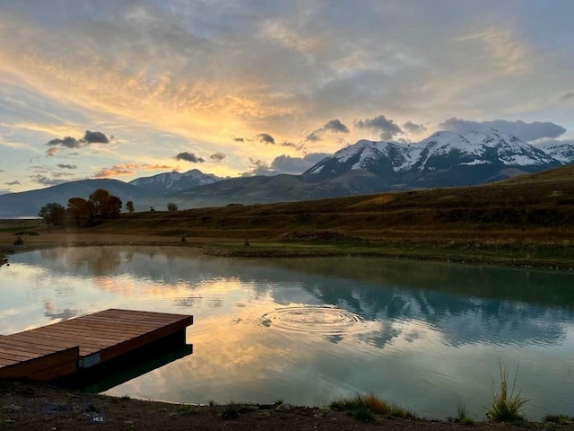 dock area featuring a water and mountain view