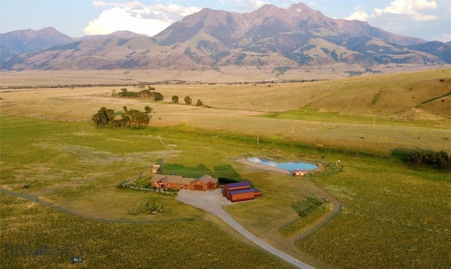 aerial view featuring a rural view and a mountain view