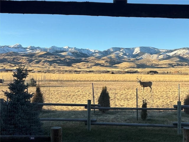 view of mountain feature with a rural view