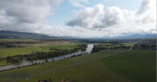 birds eye view of property with a water view and a rural view