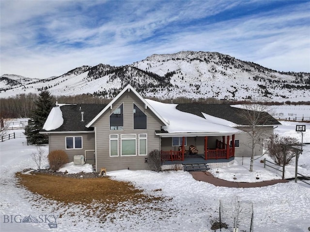 view of front facade with a mountain view and a porch