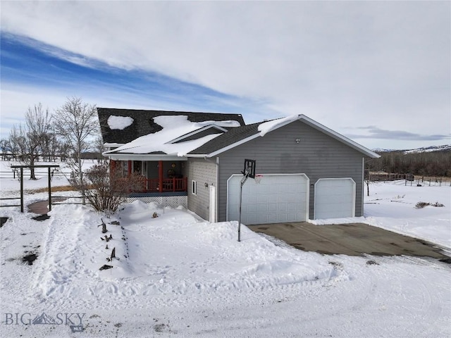 view of front of home featuring covered porch and an attached garage