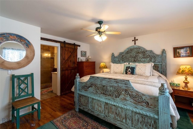 bedroom featuring a barn door, a ceiling fan, and wood finished floors