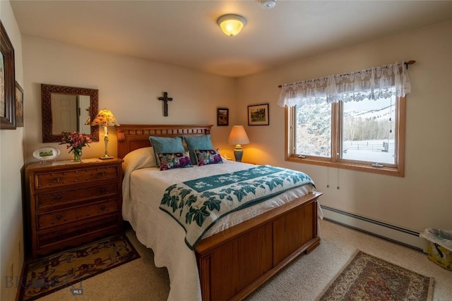 bedroom with a baseboard radiator and light colored carpet