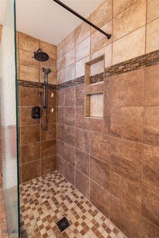 full bathroom featuring a shower stall