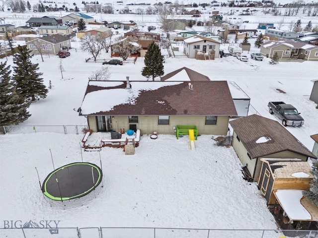 snowy aerial view with a residential view