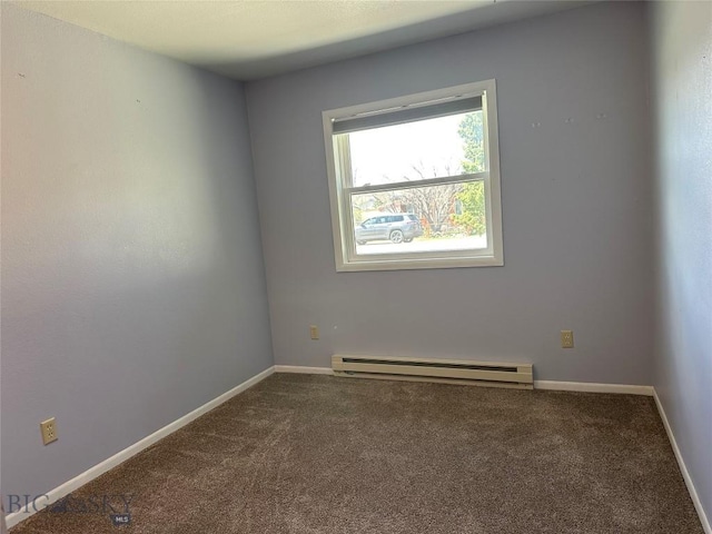 727 Mirza Way, Ennis, MT 59729 - carpeted empty room featuring a baseboard heating unit and baseboards