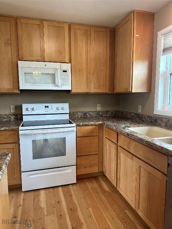 727 Mirza Way, Ennis, MT 59729 - kitchen with white appliances and light wood-style floors