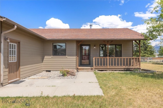 727 Mirza Way, Ennis, MT 59729 - entrance to property featuring a porch, a lawn, and roof with shingles