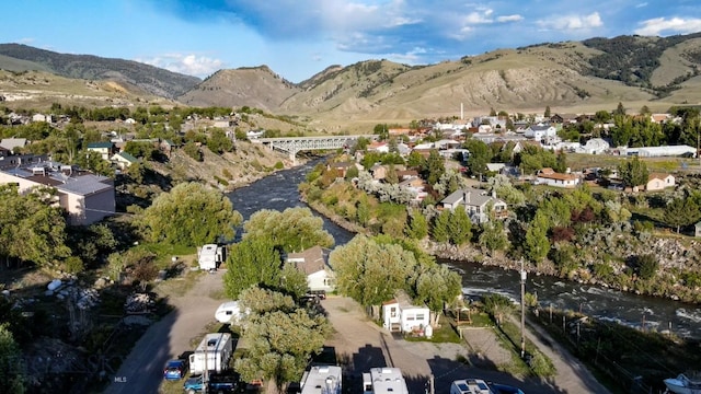 aerial view featuring a water and mountain view