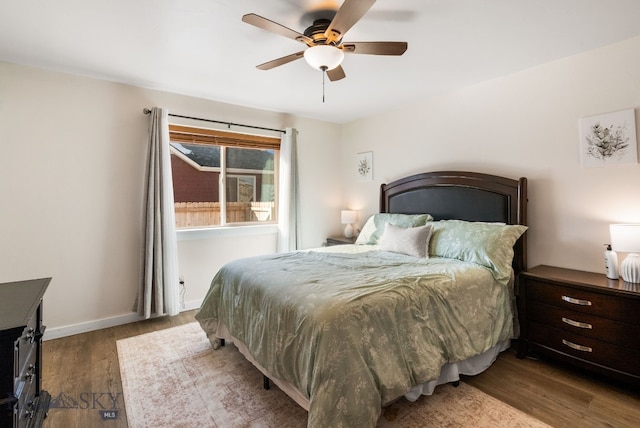 84 Tail Feather Ln Unit B, Bozeman, MT 59718 - bedroom with wood finished floors and ceiling fan