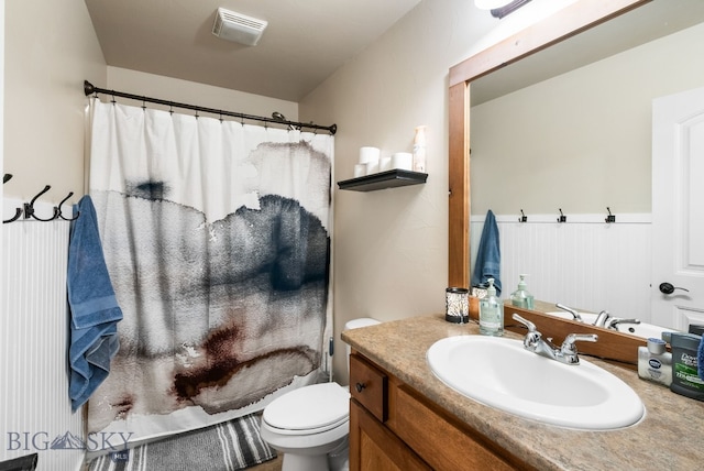 84 Tail Feather Ln Unit B, Bozeman, MT 59718 - bathroom with vanity, a shower with curtain, and a wainscoted wall
