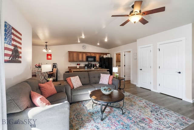 84 Tail Feather Ln Unit B, Bozeman, MT 59718 - living room with vaulted ceiling, wood finished floors, and ceiling fan