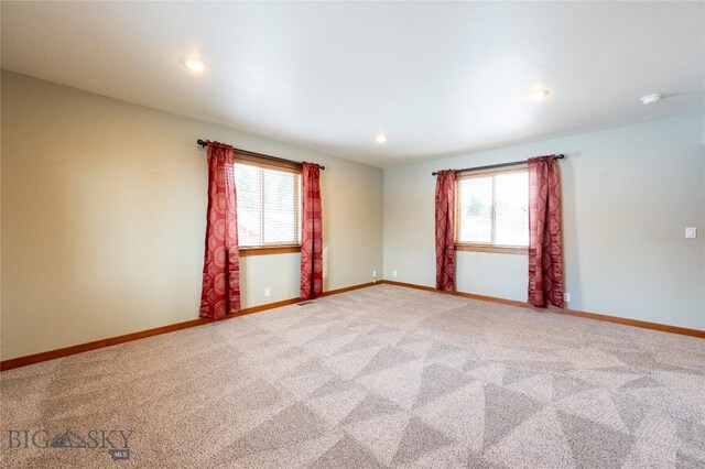 2212 Sourdough Rd, Bozeman, MT 59715 - unfurnished room featuring healthy amount of natural light, light carpet, baseboards, and recessed lighting