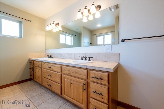 2212 Sourdough Rd, Bozeman, MT 59715 - full bath featuring plenty of natural light, double vanity, baseboards, and tile patterned flooring