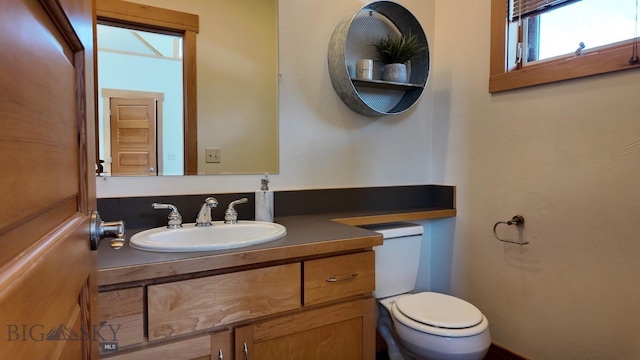 1281 Stoneridge Unit A, Bozeman, MT 59718 - half bathroom featuring toilet and vanity