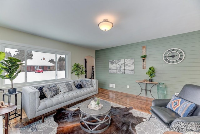 700 4th, Deer Lodge, MT 59722 - living area featuring arched walkways and wood finished floors